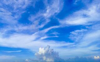 Blue sky with chemical chemtrails cumulus clouds scalar waves sky. photo