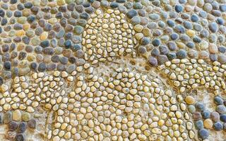 Texture detail of wall with sea turtle rocks stones Mexico. photo