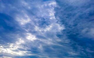 Blue sky with chemical chemtrails cumulus clouds scalar waves sky. photo