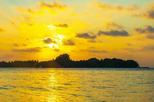 Kuramathi Maldives tropical paradise island sunset view from Rasdhoo. photo
