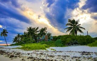 Awesome sunset at tropical Caribbean beach Playa del Carmen Mexico. photo