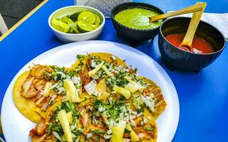 Mexican tacos with lime hot sauce pineapple and onions Mexico. photo