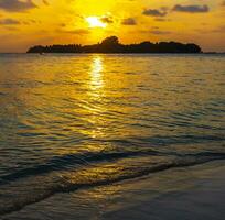 Kuramathi Maldives tropical paradise island sunset view from Rasdhoo. photo