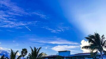 Blue sky with chemical chemtrails cumulus clouds scalar waves sky. photo