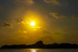 Kuramathi Maldives tropical paradise island sunset view from Rasdhoo. photo