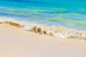 Waves at tropical beach caribbean sea clear turquoise water Mexico. photo