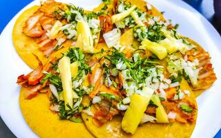 Mexican tacos with lime hot sauce pineapple and onions Mexico. photo