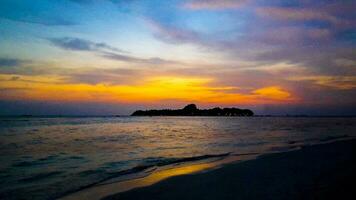 Kuramathi Maldives tropical paradise island sunset view from Rasdhoo. photo
