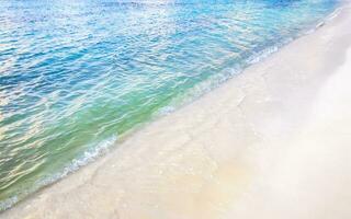 Waves at tropical beach caribbean sea clear turquoise water Mexico. photo