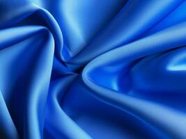 blue satin fabric as background close - up photo