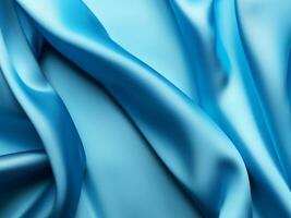 blue satin fabric as background close - up photo