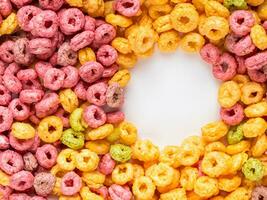 colorful cereal rings on white background photo
