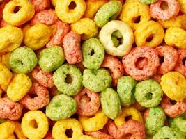 colorful cereal rings on white background photo