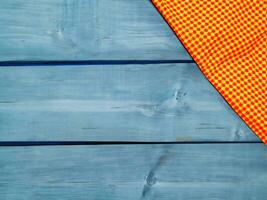 top view of orange striped towel on wooden table photo