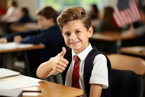 Portrait of cute schoolboy with glasses showing thumbs up in classroom Generative AI photo