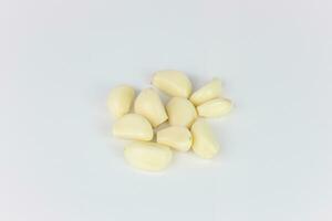 garlic cloves on white background photo