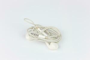 White earphones isolated on white background with copy space for text. photo