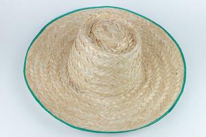 Straw hat isolated on white background. Top view. Flat lay. photo