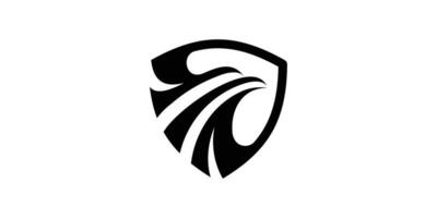 The logo design combines the shape of a shield with an eagle. vector