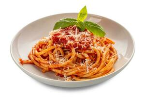 Bucatini with tomato sauce and basil leaves and parmesan cheese, pasta amatriciana in white plate isolated on white with clipping path included photo