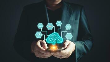 man uses a smartphone and a cloud computing diagram. data storage.the use of online digital network technology in business, buying, and selling commerce online digital marketplace. photo