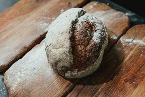 Freshly baked bread with a golden crust close up photo