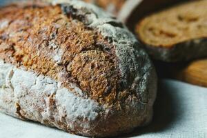 Freshly baked bread with a golden crust close up photo