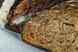 Freshly baked bread with a golden crust close up photo