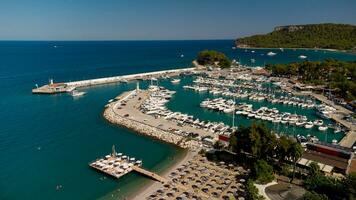 Aerial view of of port and coastal area of Kemer, Turkish beach resort city photo