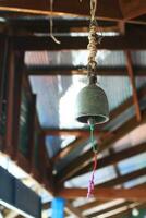 Vintage Bells Hanging on pagoda in temple or school in Thailand photo