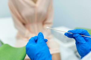 Vaginal Smear. Close-up of doctor hand holds gynecological examination instruments. Gynecologist working in the obstetrics and gynecology clinic. photo