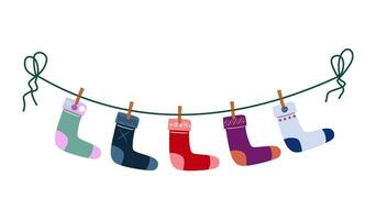 a set of children's socks are dried on a rope. flat vector illustration isolated on white background