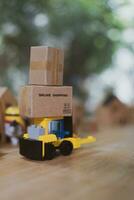 Parcel boxes of products on mini forklift truck related buy from online store. photo