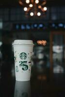 Bangkok, Thailand - October 17, 2023 A reusable cup, 25th Anniversary, Starbucks Thailand, get 1 free. photo