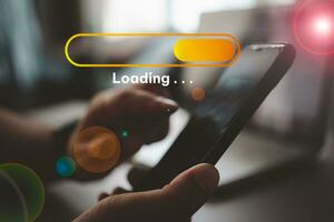 Hand man using mobile smartphone and loading icon for download and waiting to loading. photo