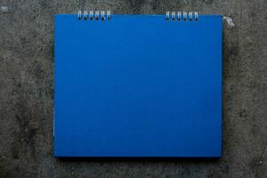 Blank blue paper desk spiral calendar photo