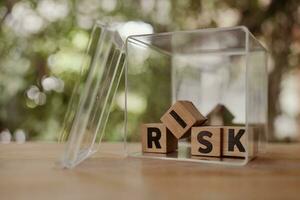 Wooden cubes with risk words in the box. Risk management concept. photo