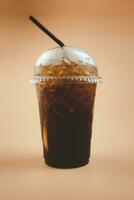 Iced soft drink with iced and lemon slice in take away glass photo
