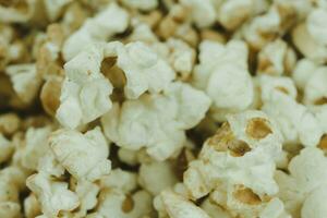 Fresh popcorn close up. Shallow depth of field. photo