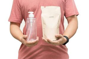 Man choosing shampoo plastic packaging for refill pouch isolated on white background. Zero waste. Reuse reduce recycle concept. photo