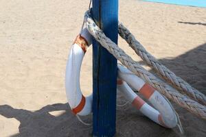 Thick hemp rope on the pier in the seaport. photo