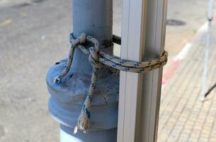 Thick hemp rope on the pier in the seaport. photo