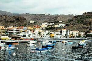 boats in the harbor of a small town photo