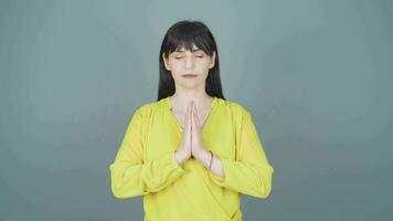 Woman meditating looking at camera. video