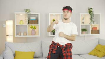 Man boxing at home in a funny way. video