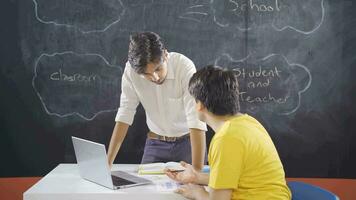 Teacher and student with mental retardation discussing a question. video