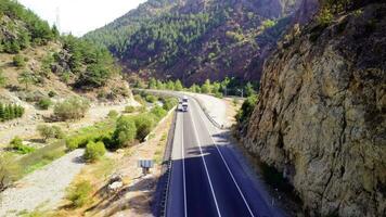 Panorama landscape of highway road between mountains. Freeway road aerial view. video