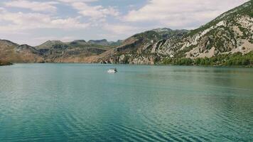 Aerial view boat with tourists sailing on the reservoir Green Canyon Turkey . video