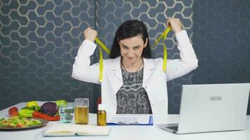 The dietitian leaving the tape measure near the vegetables. Healthy eating. video