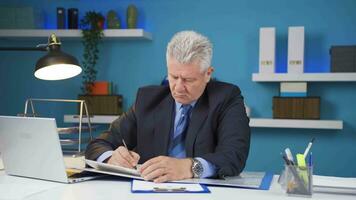 Businessman working looking at paperwork files. video